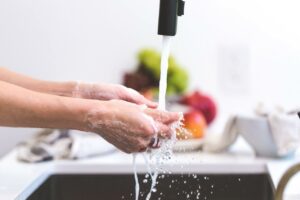 person washing their hands